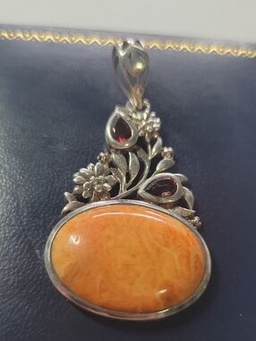 Sterling Silver Orange Stone Floral Pendant with Garnet Accents